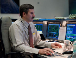 Mike Sarafin at his desk at the Mission Control Center at NASA's Johnson Space Center.