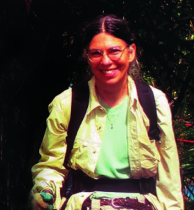 Dr. Lodge wear waders and a backpack