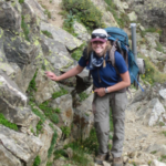 Dr. Pelz hikes on a rocky trail.