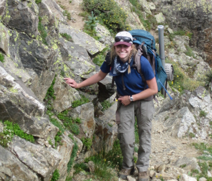 Dr. Pelz hikes on a rocky trail.