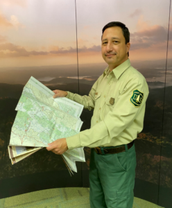 Robert West in Uniform holding a paper map