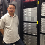 Shyy-Chin Chen in front of a computer system