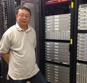 Shyy-Chin Chen in front of a computer system