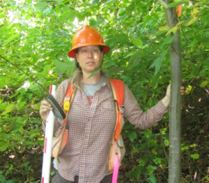 Stacy Clark in protective gear in the forest