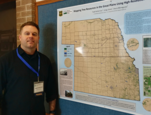 Todd Kelerman in front of a map