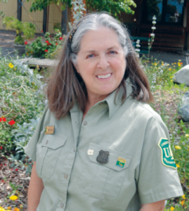 A headshot of Ms. Rechel in a garden