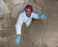 Dan Neubaum in a cave with a hard hat