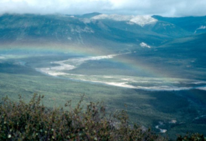 A rainbow in a mountain area